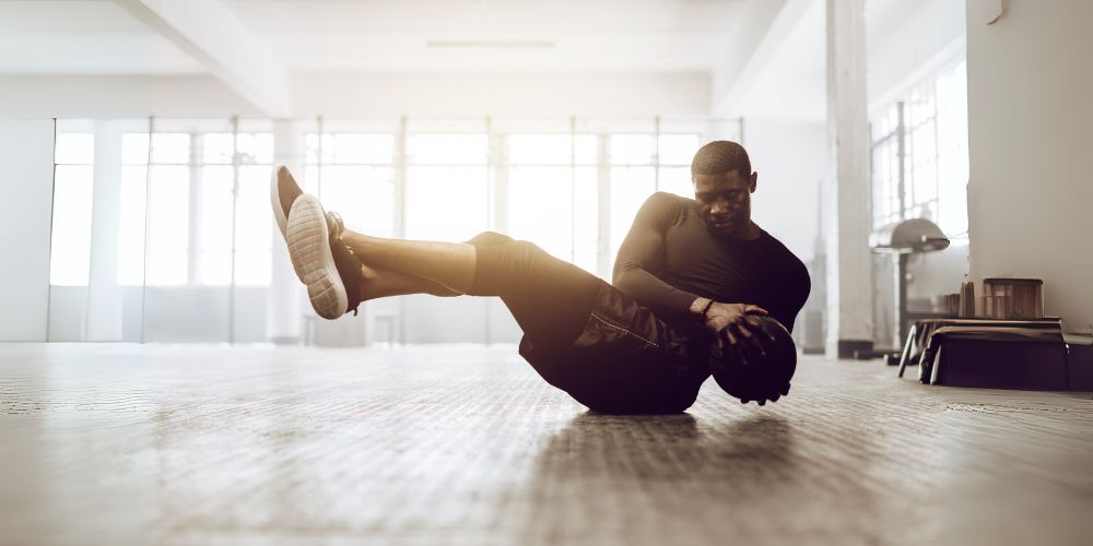 A man exercising with a ball