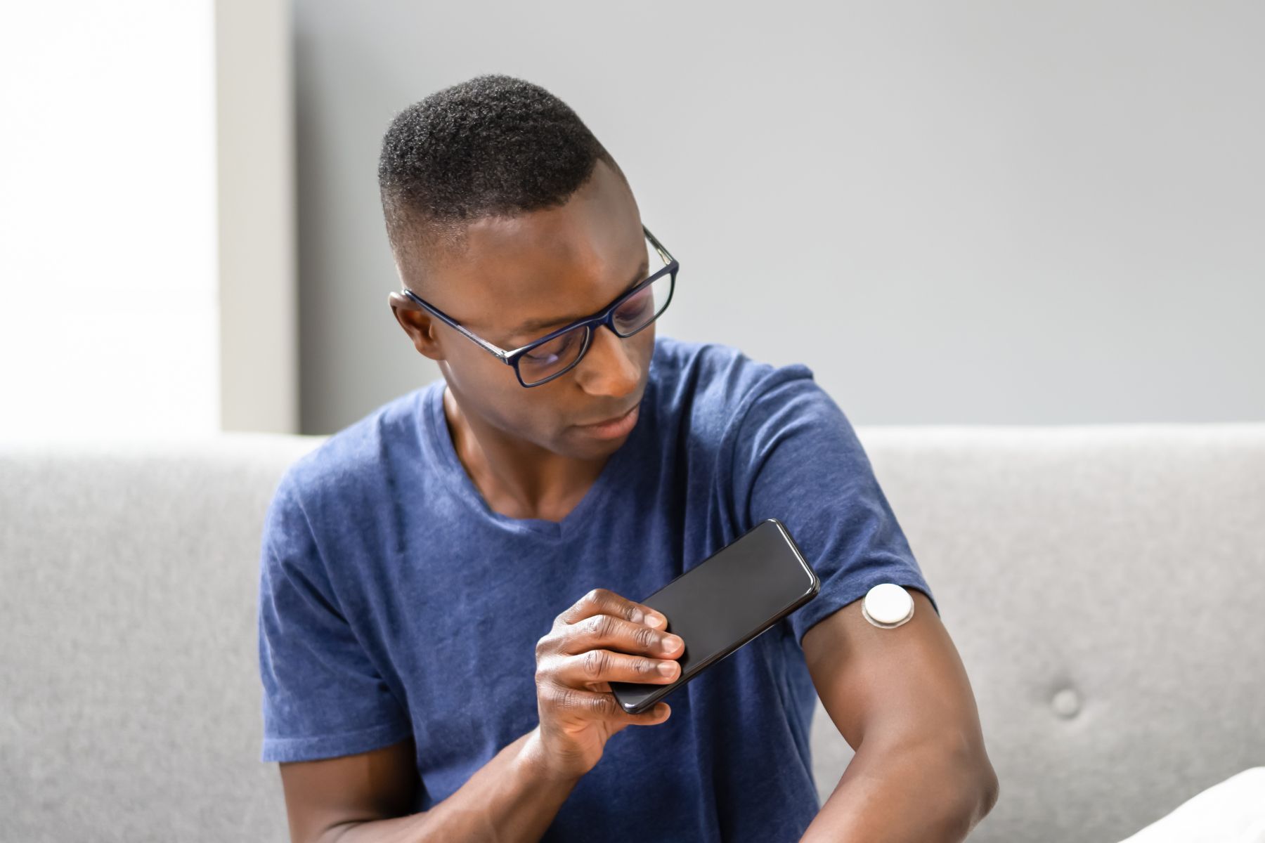 glucose Black man with glucose monitor